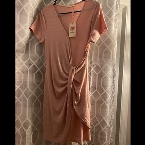 Pale pink & fits like a medium but has stretch